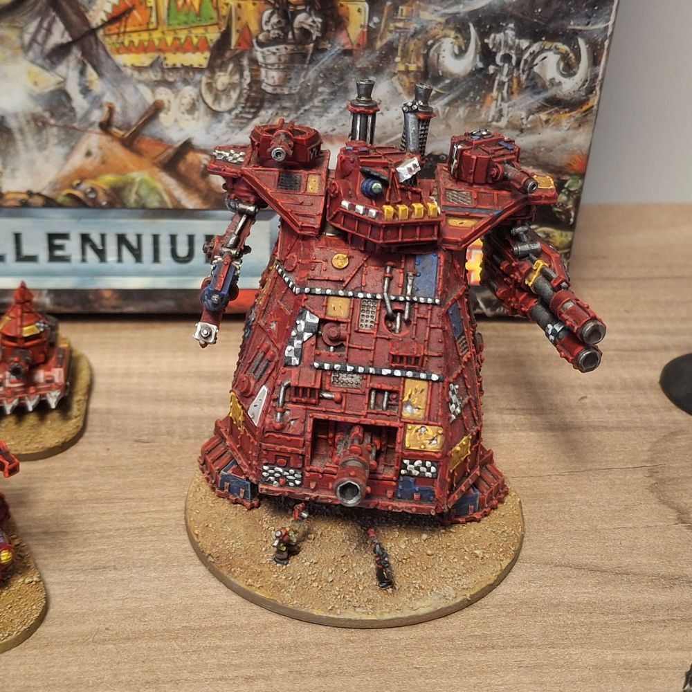 A lovely mostly red Great Gargant for epic 40k 3rd edition. A commissar and wild boy battle on its base.