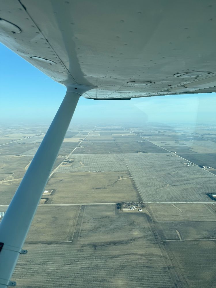 A peaceful view from a Cessna over farmland