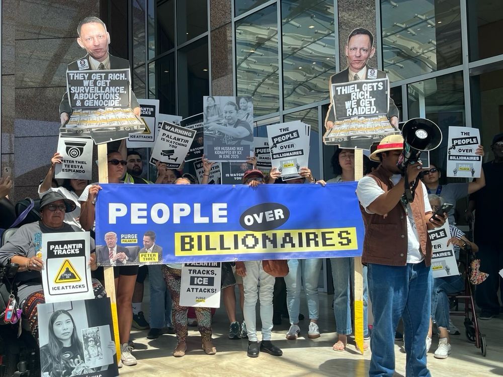 Hundreds of Californians protest #PurgePalantir National Week of Action banner PEOPLE OVER BILLIONAIRES