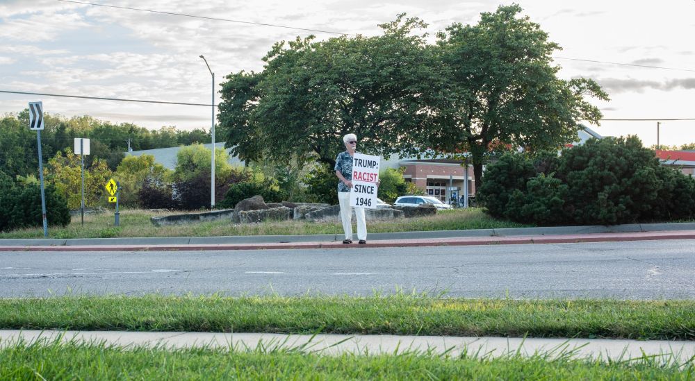 Intrepid Protester on sidewalk of intersection of 29th & Urish Rd Topeka KS
TRUMP RACIST SINCE 1946