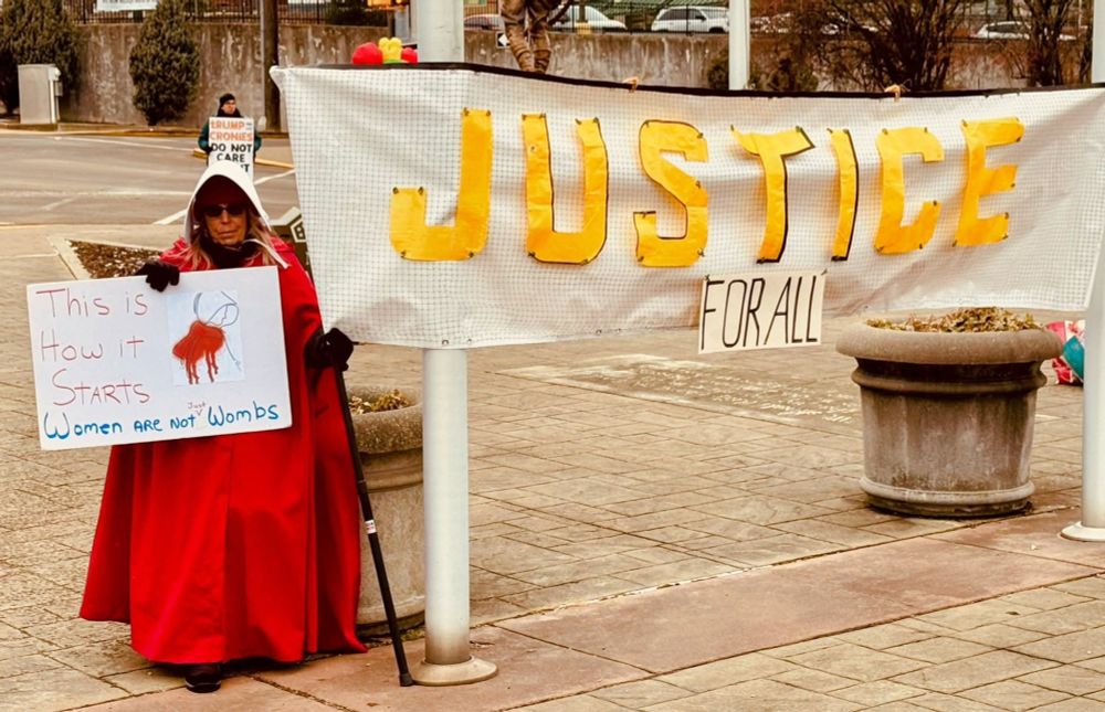 Resistance Uniontown PA
banner & Handmaid holding a sign THIS IS HOW IT STARTS WOMEN ARE NOT WOMBS - JUSTICE FOR ALL