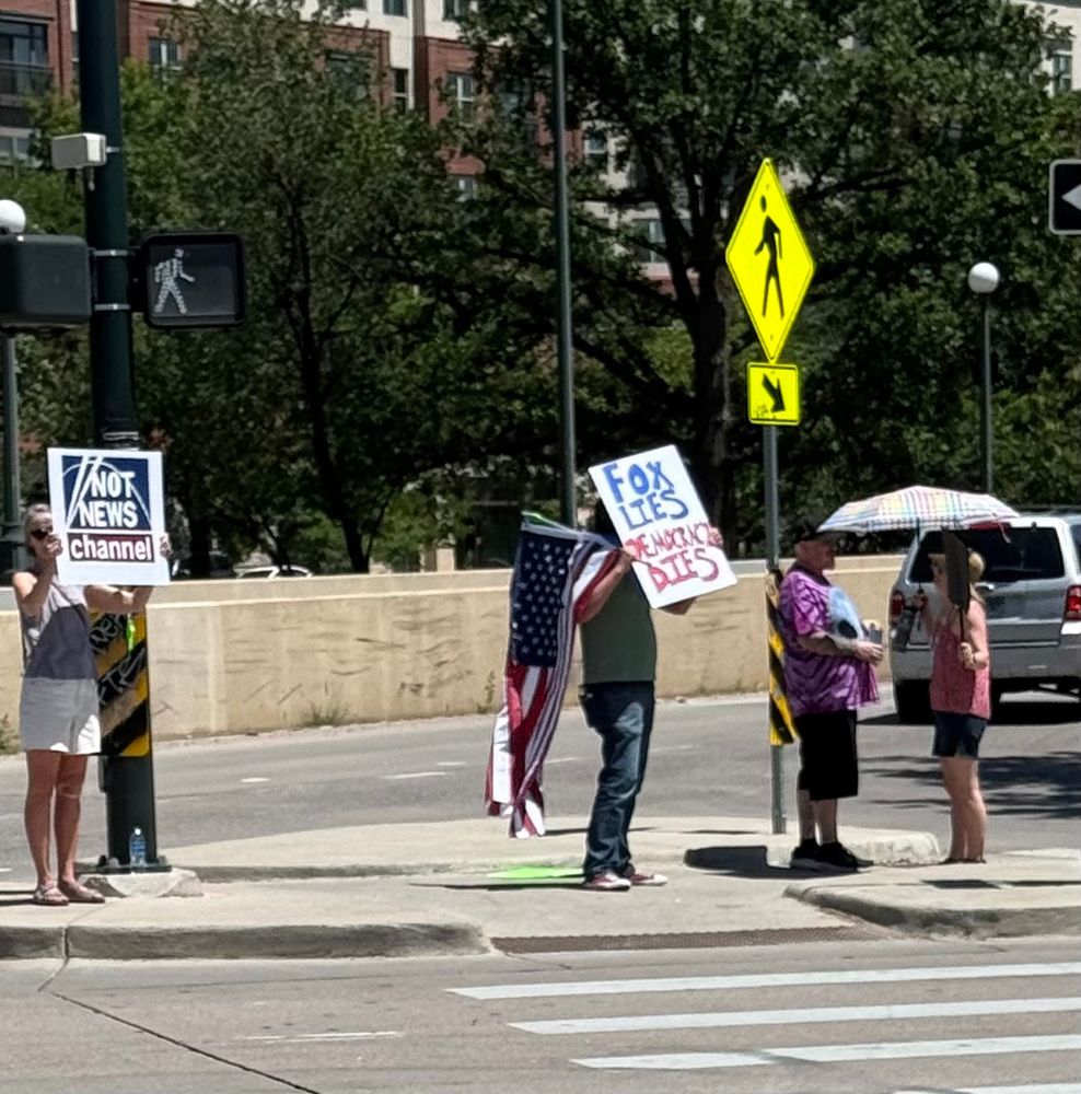 FOX protesters Denver CO
signs NOT NEWS CHANNEL - FOX LIES DEMOCRACY DIES