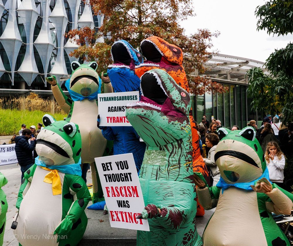 No Kings inflatable protesters London UK
-3 frogs & 3 dinosaurs
sign BET YOU THOUGHT FASCISM WAS EXTINCT