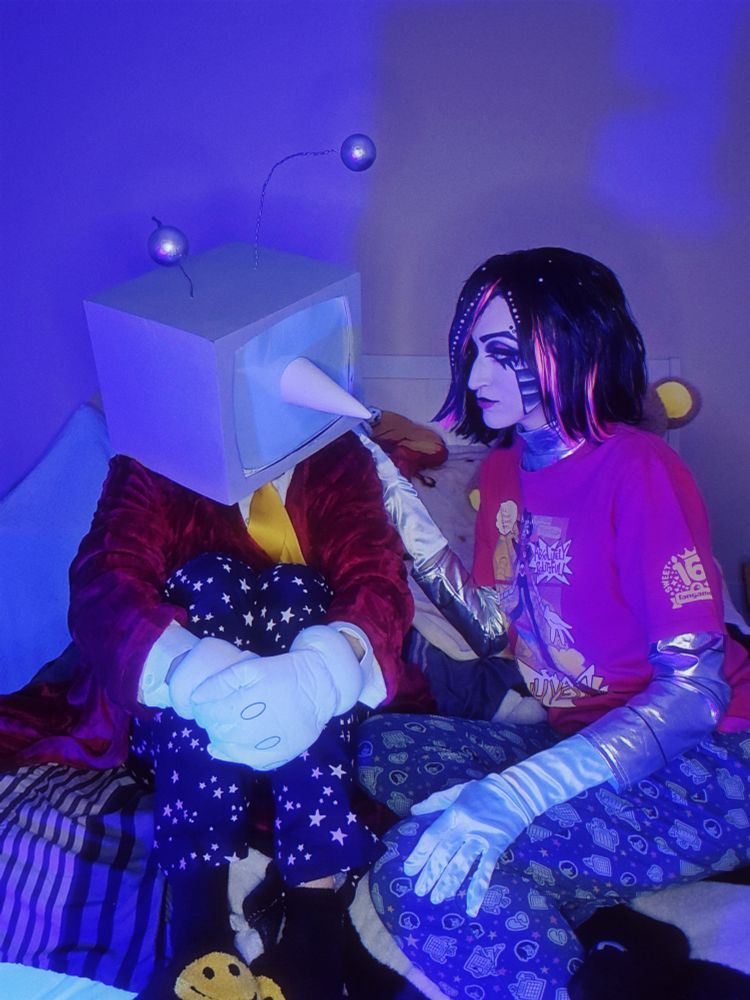 N8 and Aszii (MettaBowie) cosplaying Mr. (Ant) Tenna and Mettaton EX from Deltarune / Undertale. MTT is comforting a very glooby Tenna.