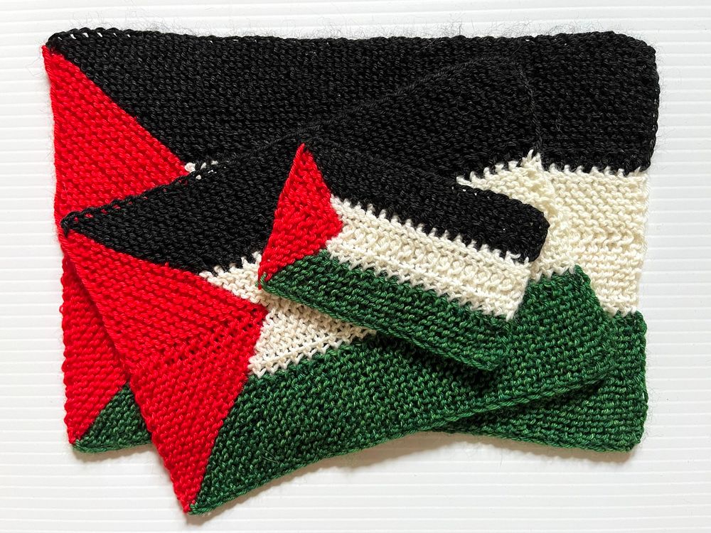 Three different sized knit Palestinian flags