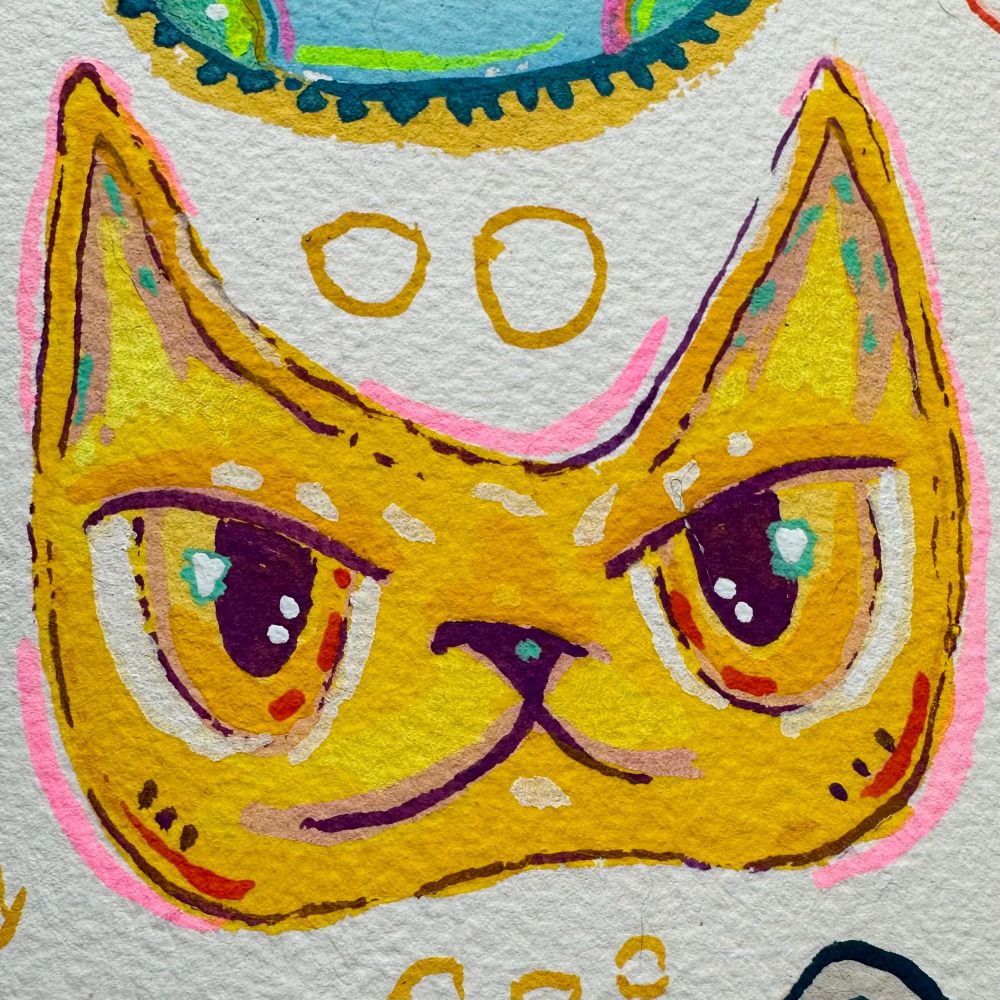 a determined looking yellow cat face painted with acryla-gouache