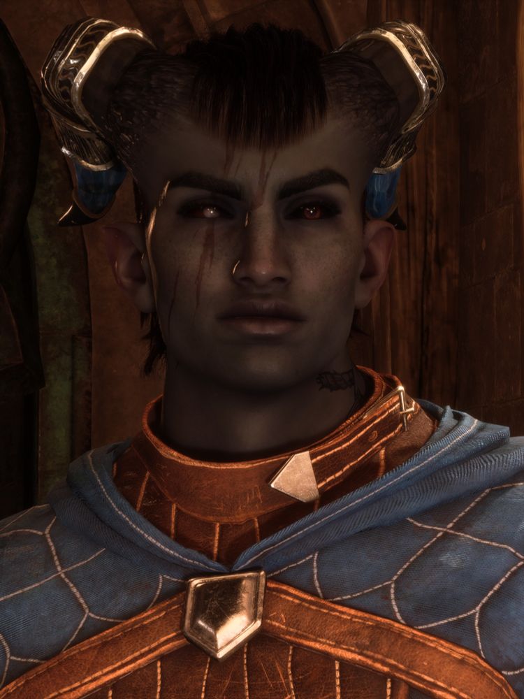 Screenshot of Simeon "Rook" Thorne, my Qunari custom main character of Dragon Age: the Veilguard from the chest up. They have grey skin and short, roughly chopped dark red hair that's combed forward between their horns. Simeon's horns follow the curve of their skull fairly closely, flaring out a little at the ends, decorated with metal plating and sections of blue gemstone.

On the right side of their face they have large, long vertical scars in the middle of their forehead, over their eye, and down their cheek. Their eyes have a black sclera, with the right eye a little bloodshot, slightly more closed and with a milky grey pupil/iris. On the left side of their neck they have a large navy blue tattoo of a thick rope and a fish you can only see a bit of.

Simeon is facing the camera, looking at someone slightly to the right and down with their eyes. They have a neutral expression on their face.
