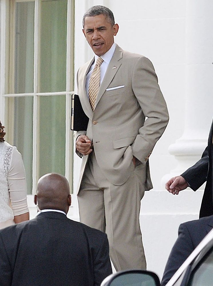 President Barack Obama, wearing a tan business suit. 