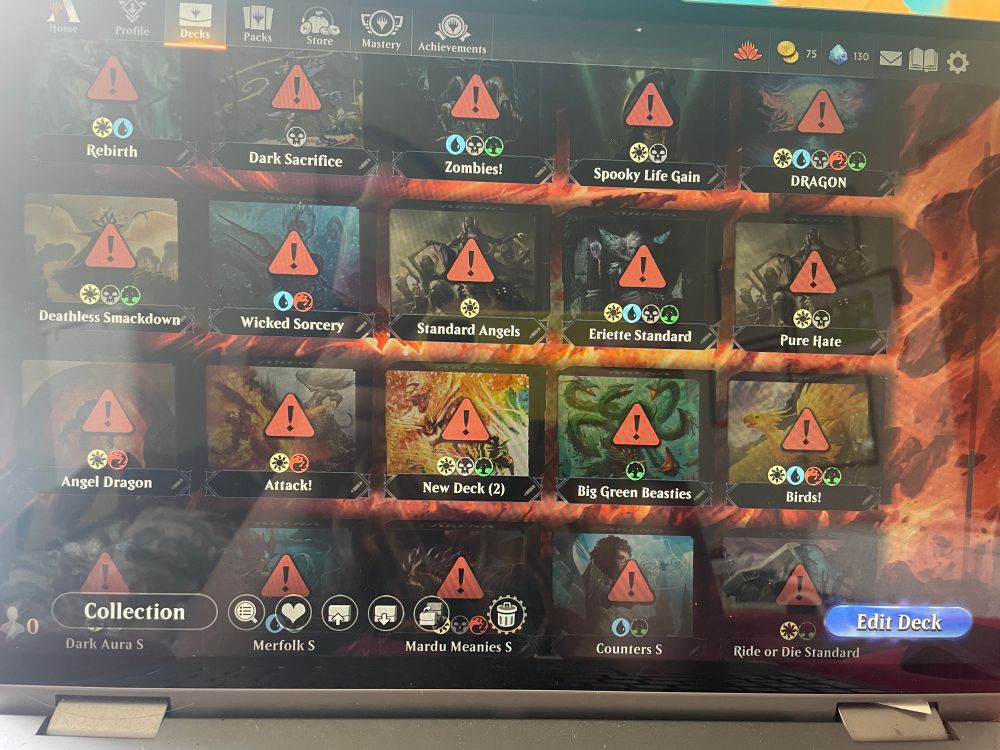 Picture of my laptop screen showing all my MTG Arena standard decks with warnings on them do to cards that have rotated out and are no longer format legal 