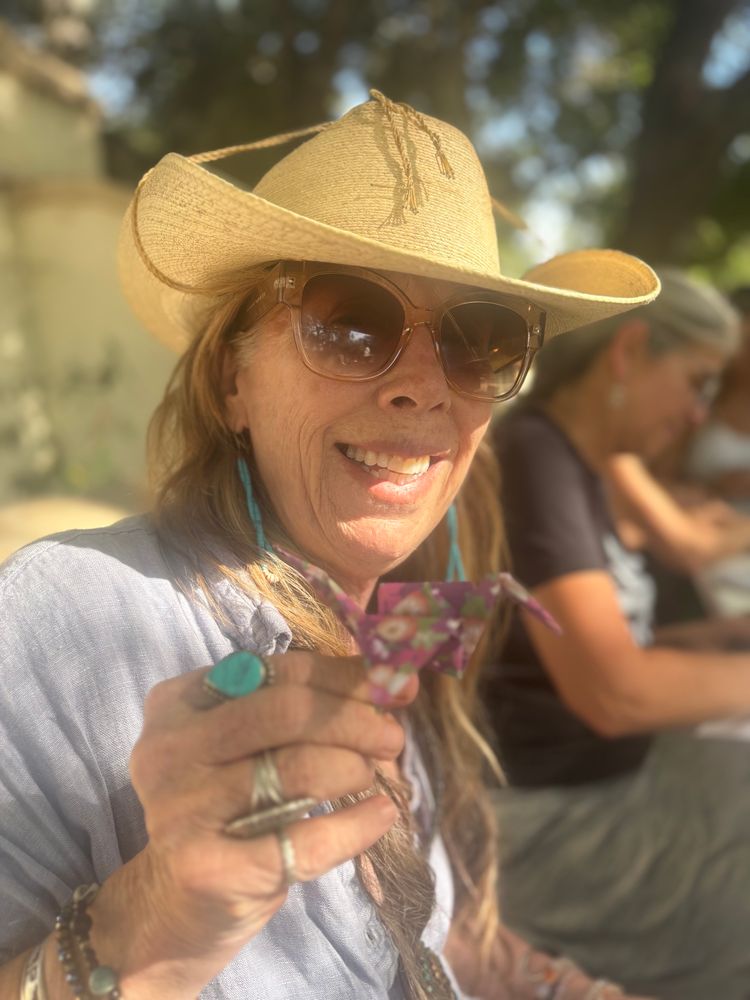 Naomi holding an origami crane