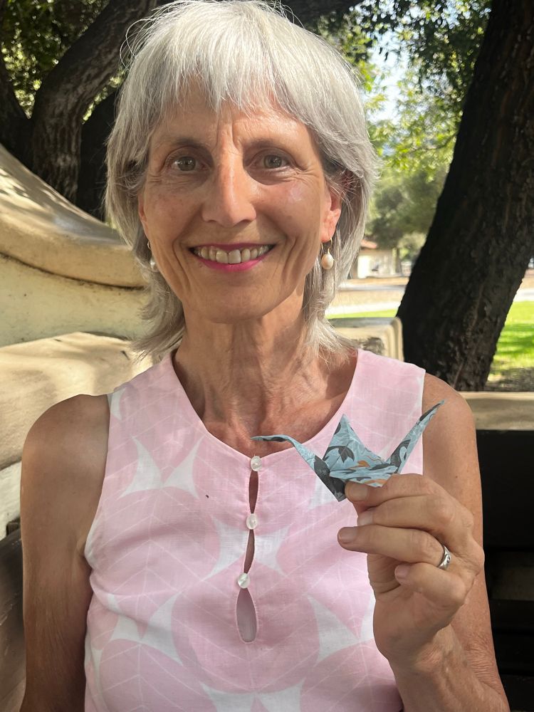 Lisa holding an origami crane