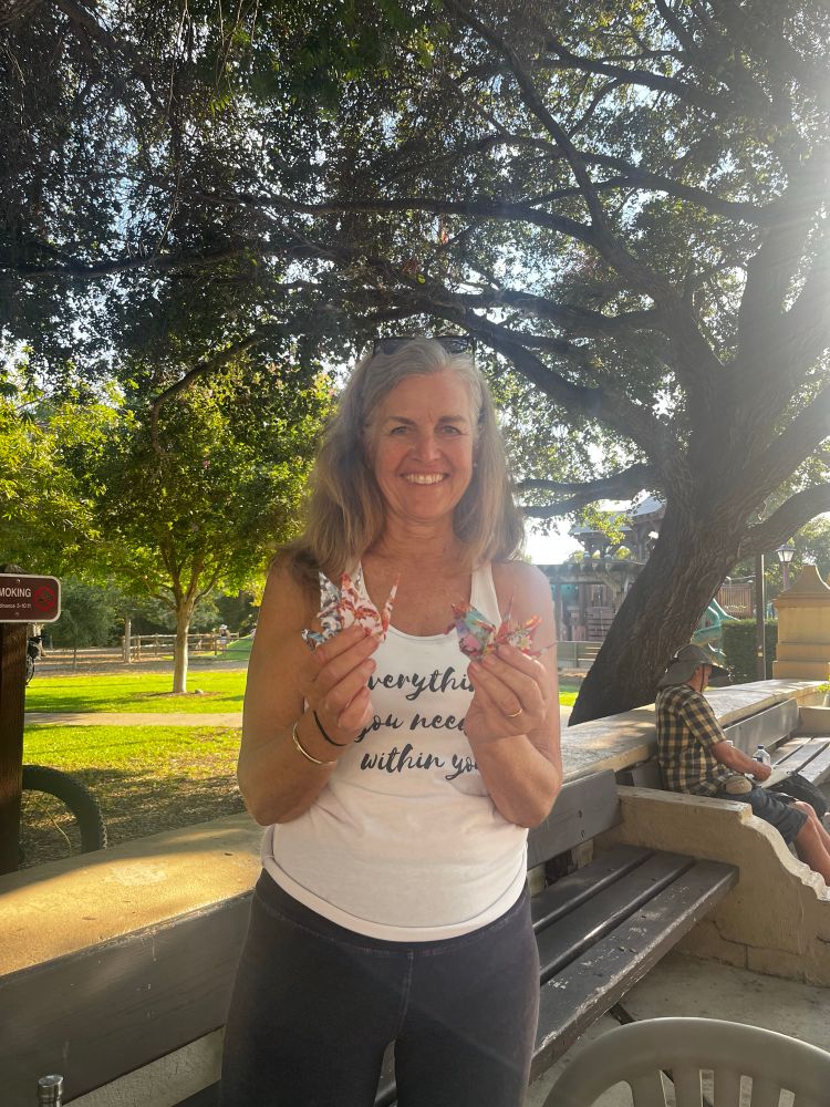 Carrie holding an origami crane