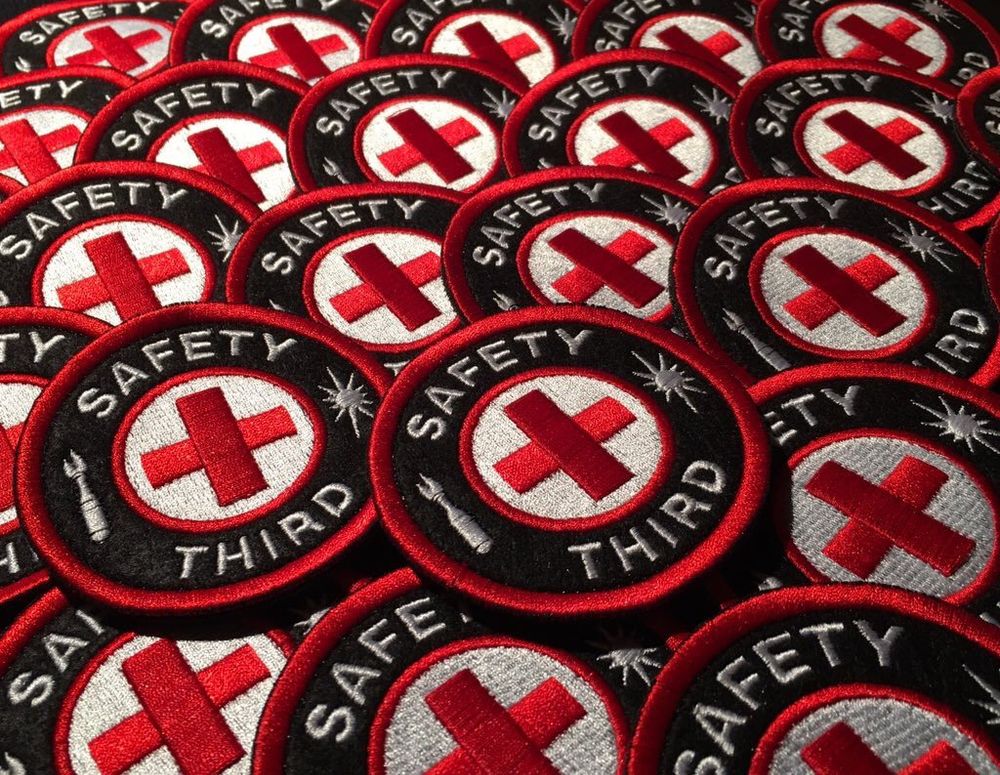pile of embroidered patches that say Safety Third