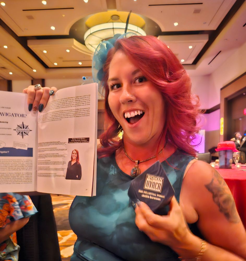 Jackie holding up her award 