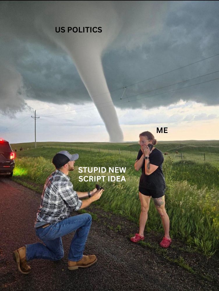 Man proposing to woman with tornado in the background, text beside man "Stupid New Script Idea" and text beside woman "Me" and text over tornado "US POLITICS"