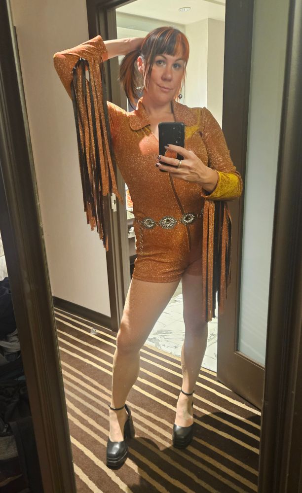 Orangw fringe and black romper