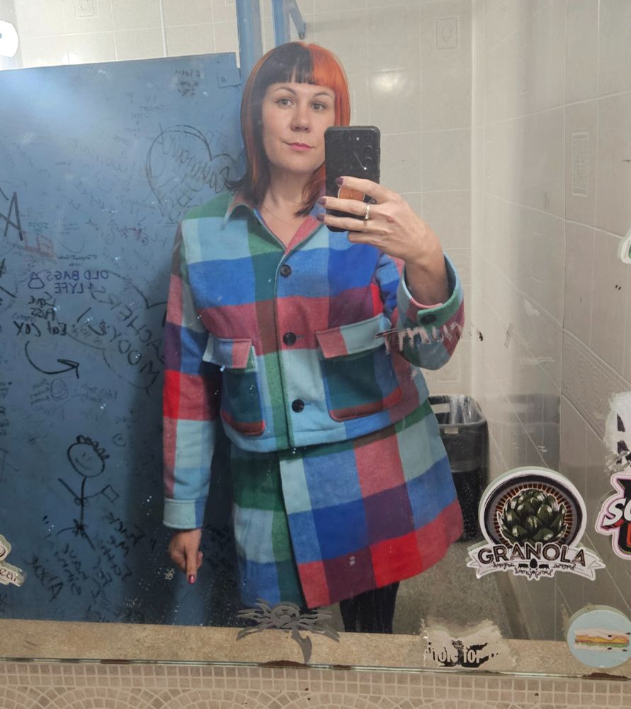 Me in the bathroom with my plaid outfit and orange black hair