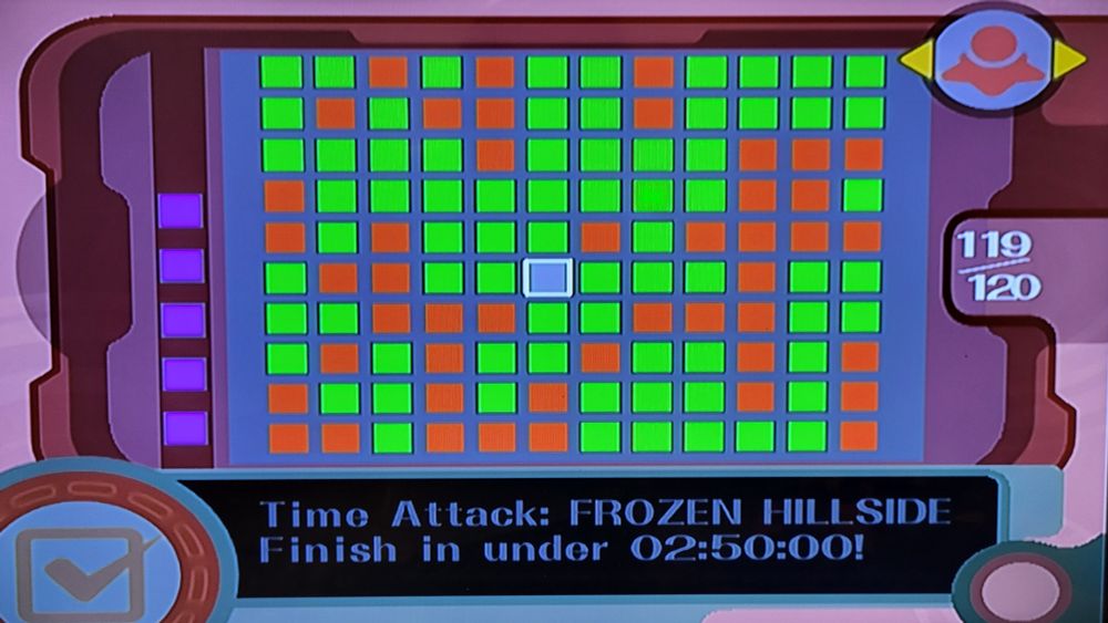 The Checklist for Air Ride, the main racing mode in Kirby Air Ride. 119 out of 120 squares are filled in and colored either green or red, with one single gray square near the middle. The objective for this square, which is visible at the bottom of the screen, says, "Time Attack. Frozen Hillside. Finish in under 2 minutes 50 seconds."