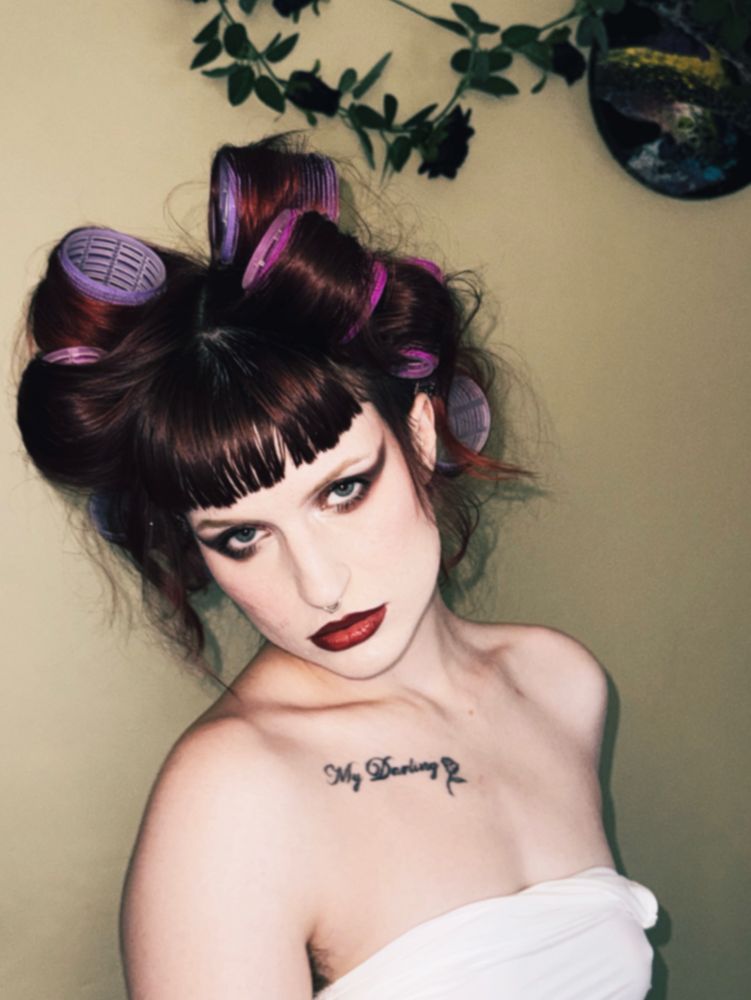 Same shoot but Stevie looking at the camera with a pouty face and the straps of the tank top have come off 