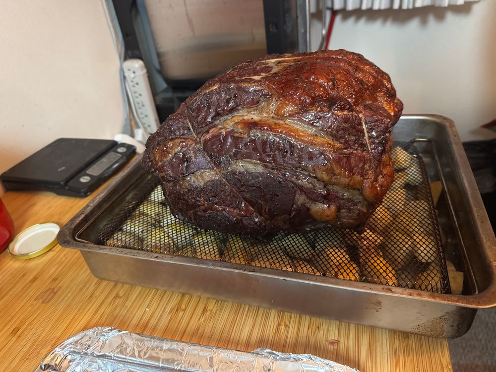 A well browned prime rib over a bed of potatoes. 

The potatoes later got broiled I'm the steaks fat to crisp and brown on all sides
