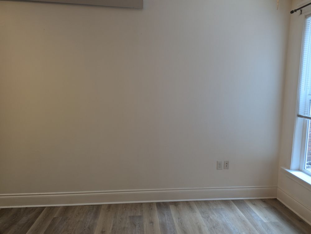 An open area by a window with natural light leading in.