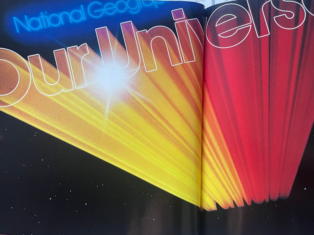 The two-page spread immediately following, with the title further along on its journey, cropping at the page edges