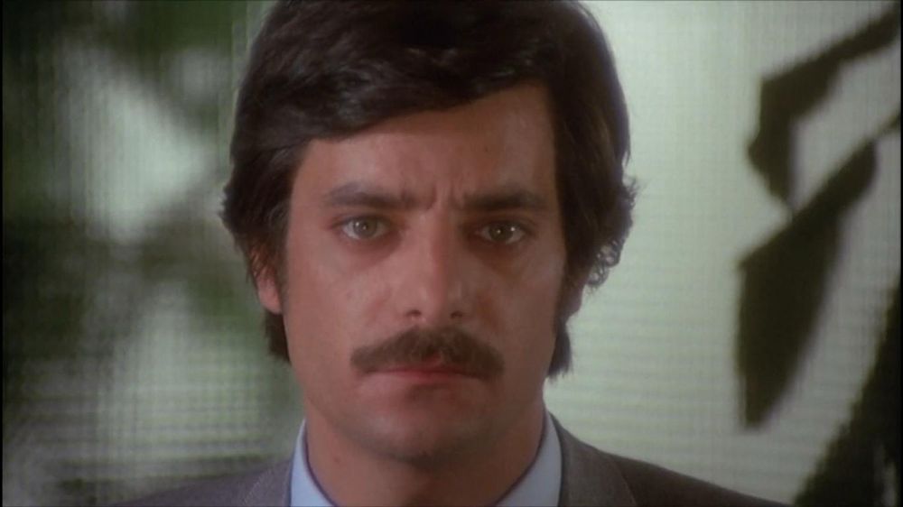 Giancarlo Giannini now with a mustache a few years later in The Black Belly of the Tarantula (1971), maybe now you suspect you almost recognize him