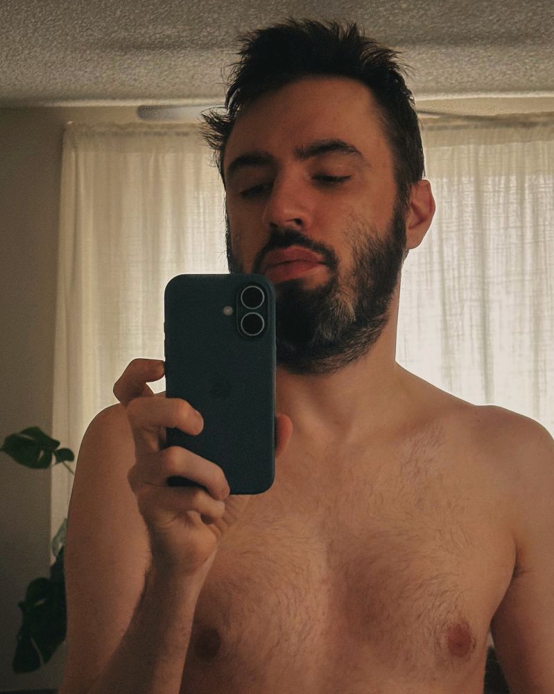 cropped tired mirror selfie