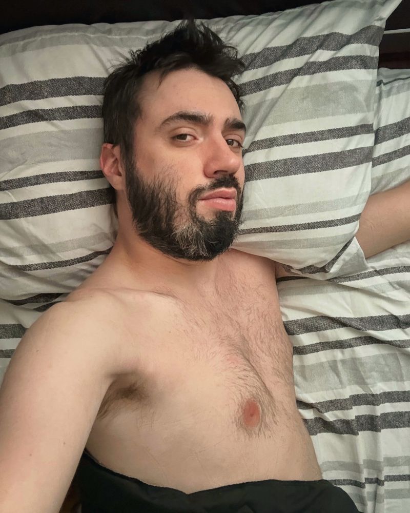 shirtless selfie in bed