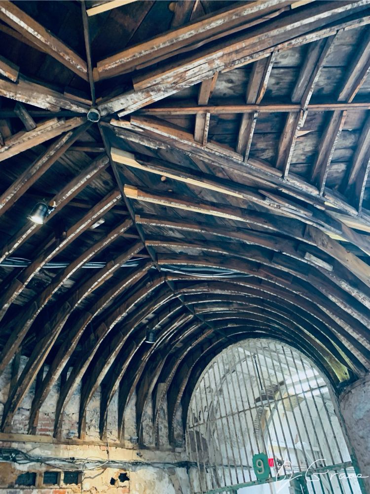 Photo of exposed wooden ceiling beams in a hallway of the Eastern State Penitentiary. 