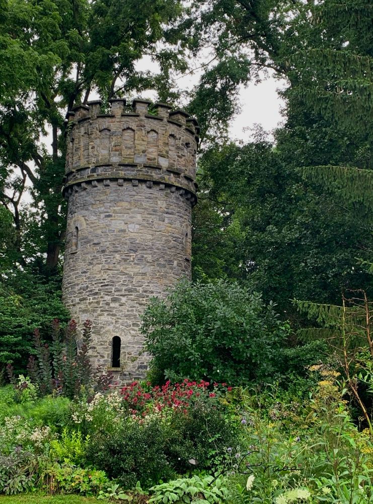 A photo of an ancient-looking tower. 