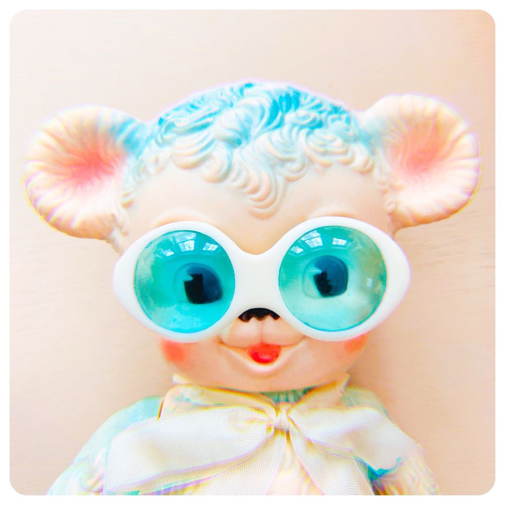 cute vintage squeak toy bear wearing glasses