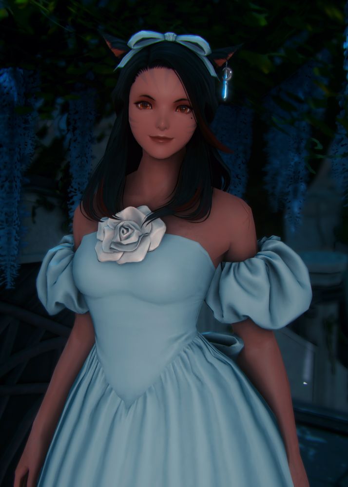 Close up of Lume wearing a long dress with a silver rose on her chest 