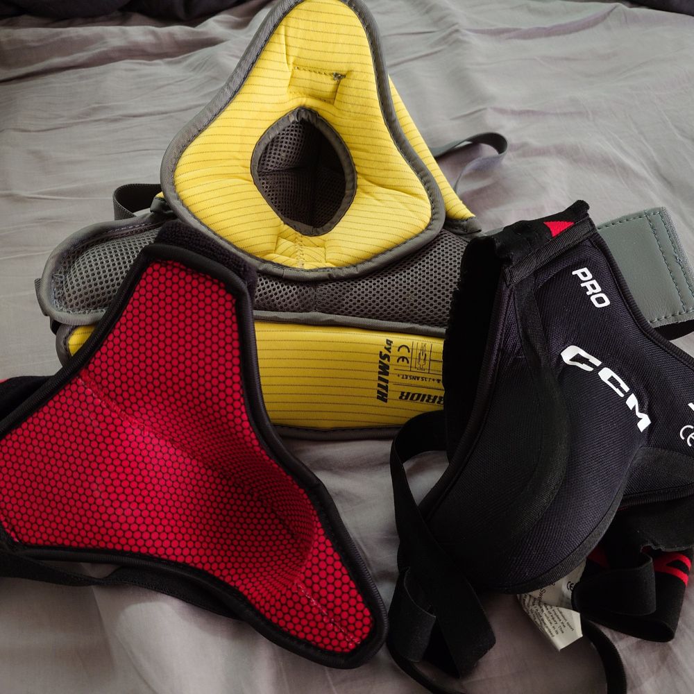 Three hockey jock cups in a pile 