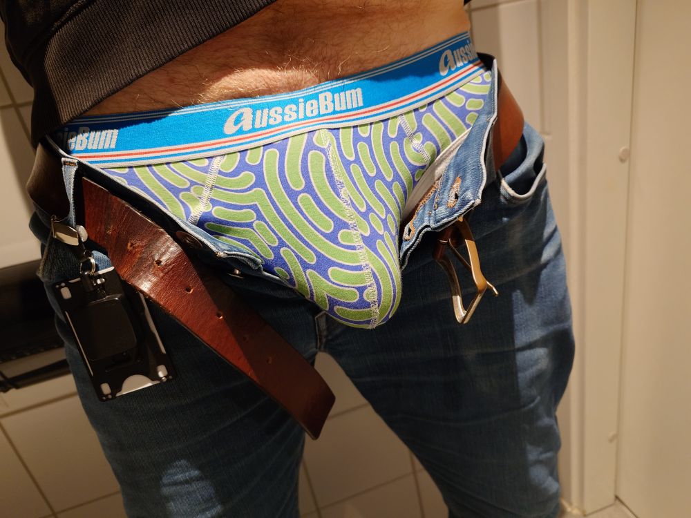 Me in unbuttoned jeans revealing my briefs with my hard cock bulging inside 