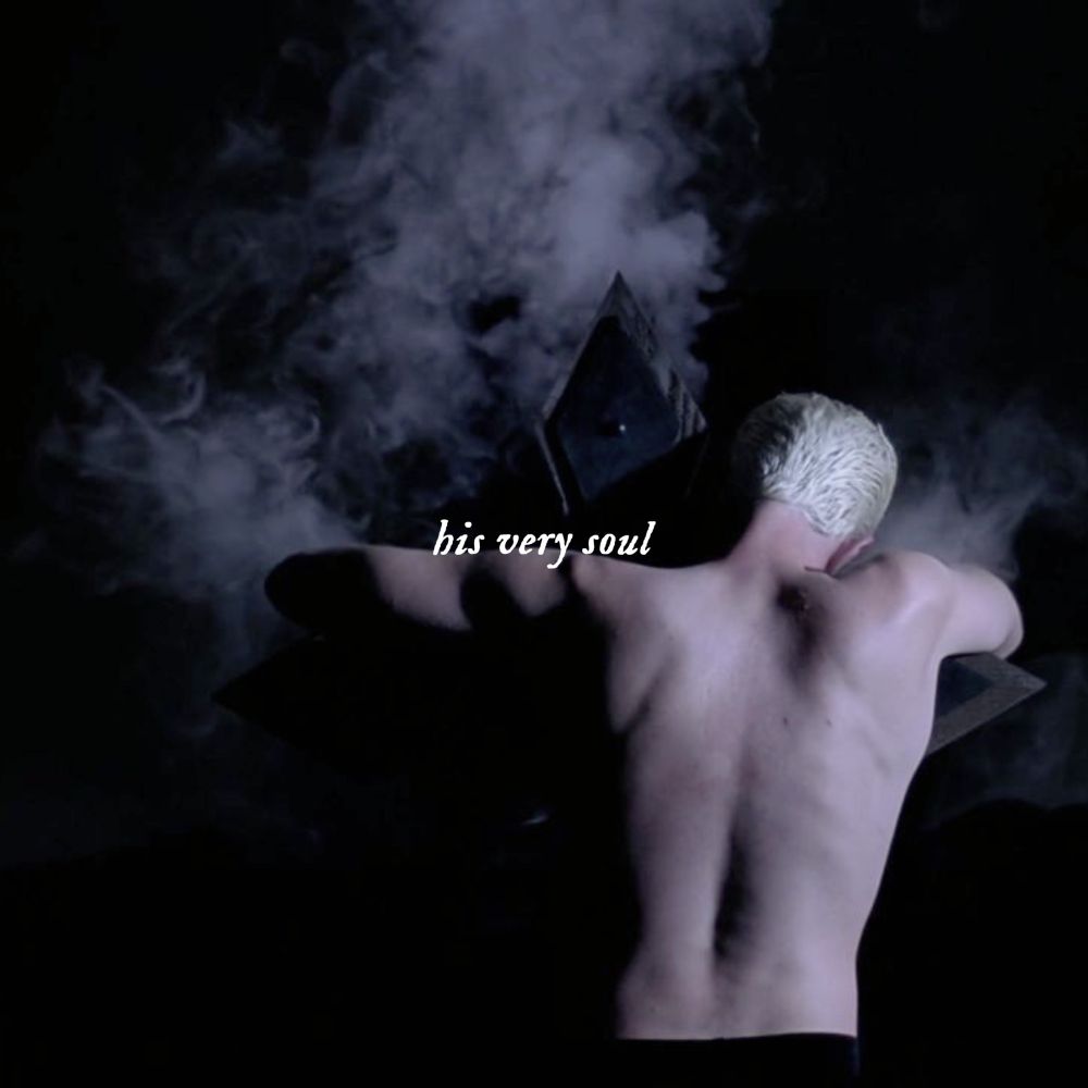 image of half-naked spike shows from the back leaning over a cross with smoke coming out from his skin in btvs 7x02 beneath you. white text over the image says “his very soul”.