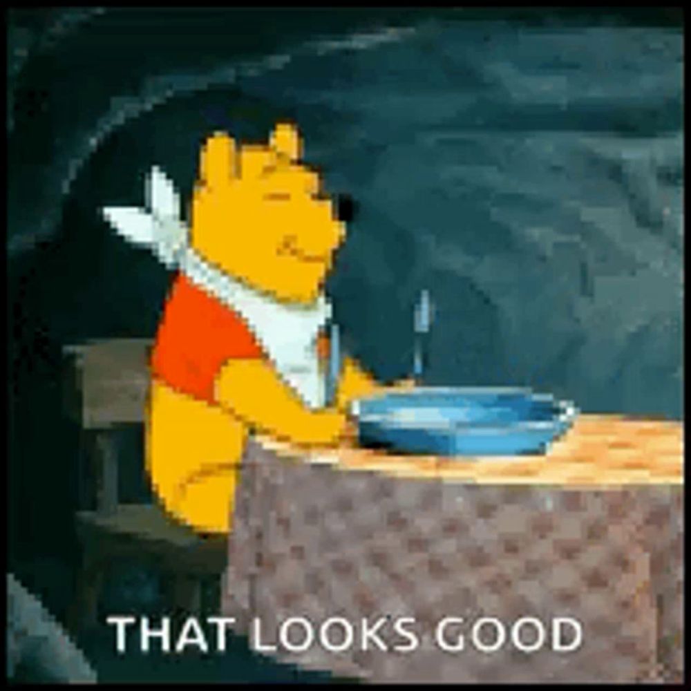 winnie the pooh is sitting at a table with a bowl of food and a fork .