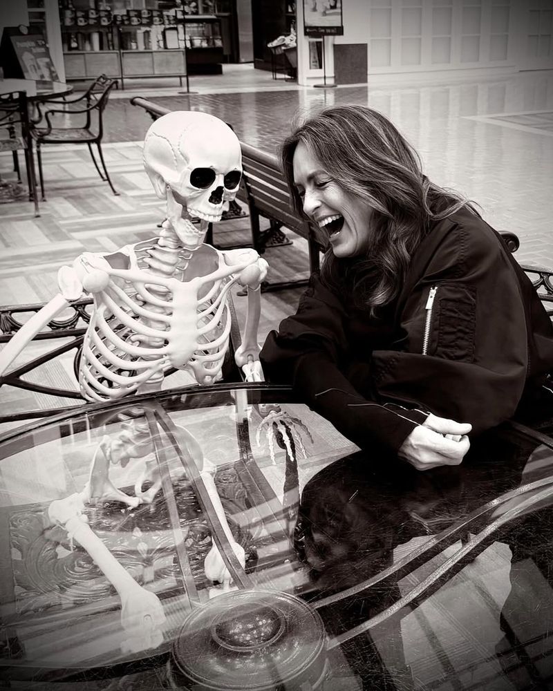 Mariska Hargitay having a laugh with a skeleton 