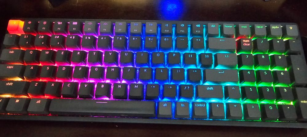 A Keychron K4 mechanical keyboard with the RGB lights turned on