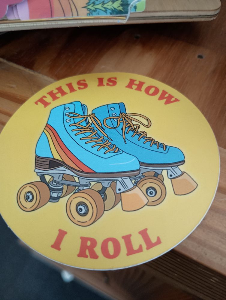 A sticker that has a picture of roller skates on them with the words "this is how I roll"