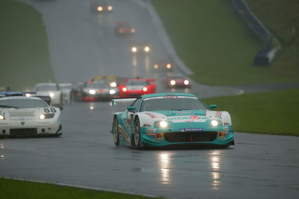 The #36 WoodOne TOM'S Toyota Supra in the rain at Fuji Speedway (2003)