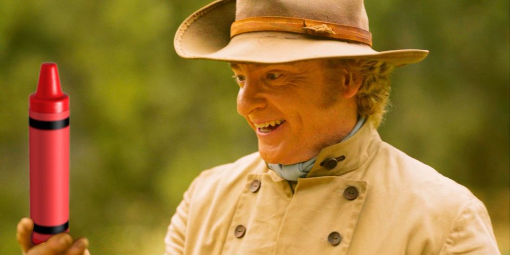 A screen shot of Stede Bonnet from Our Flag Means Death, holding a crayon and smiling maniacally in lieu of his petrified orange. 