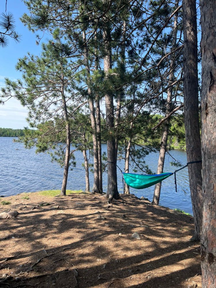 A hammock hanging from Ponderosas overlooking the boundary waters in Minnesota. 