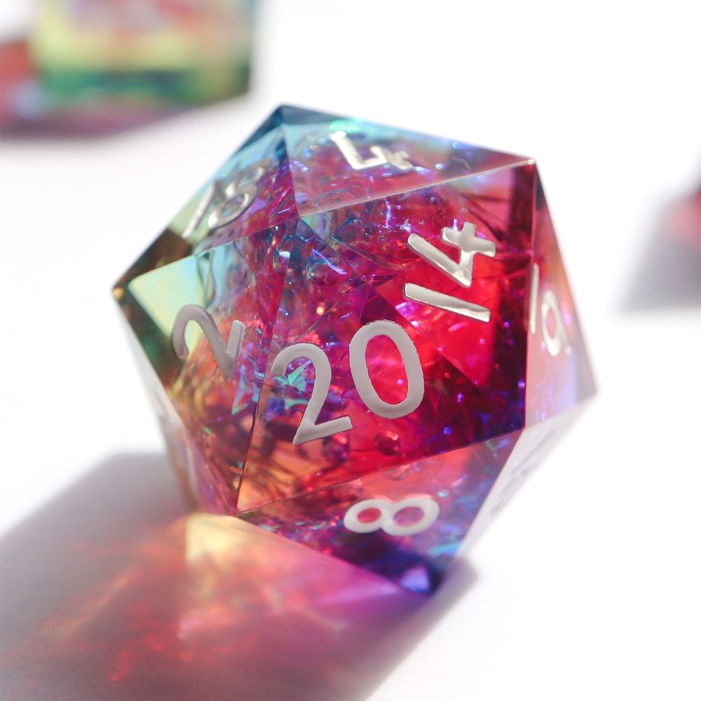 Image of the Prismatic Soul D20 on a white background. The die is a mix of red, purple, blue yellow resin with an inclusion of holographic foil. The numbers on the die white.