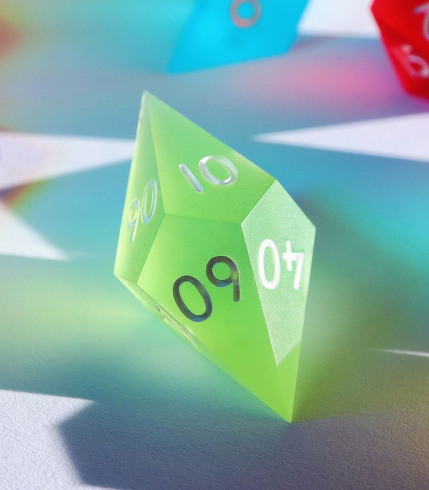 Closeup of the D100, a frosted matte die that is a bright spring green color.