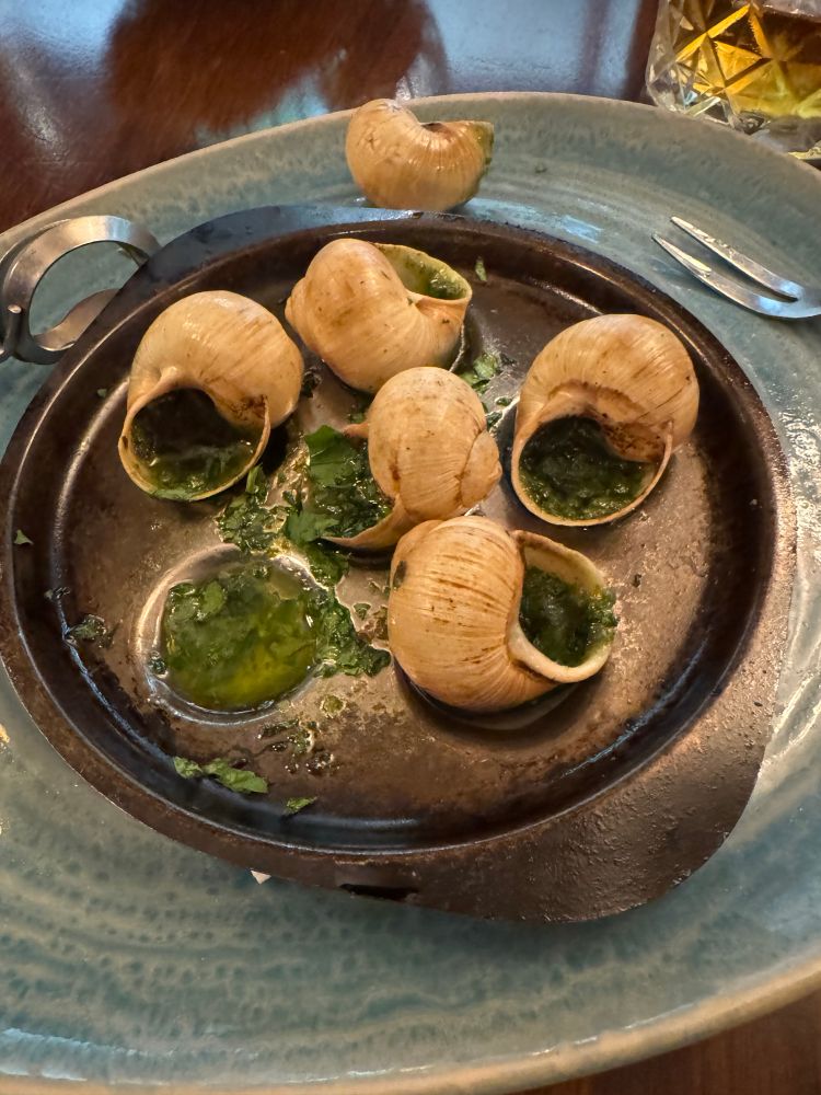six snails in garlic and parsley butter. 