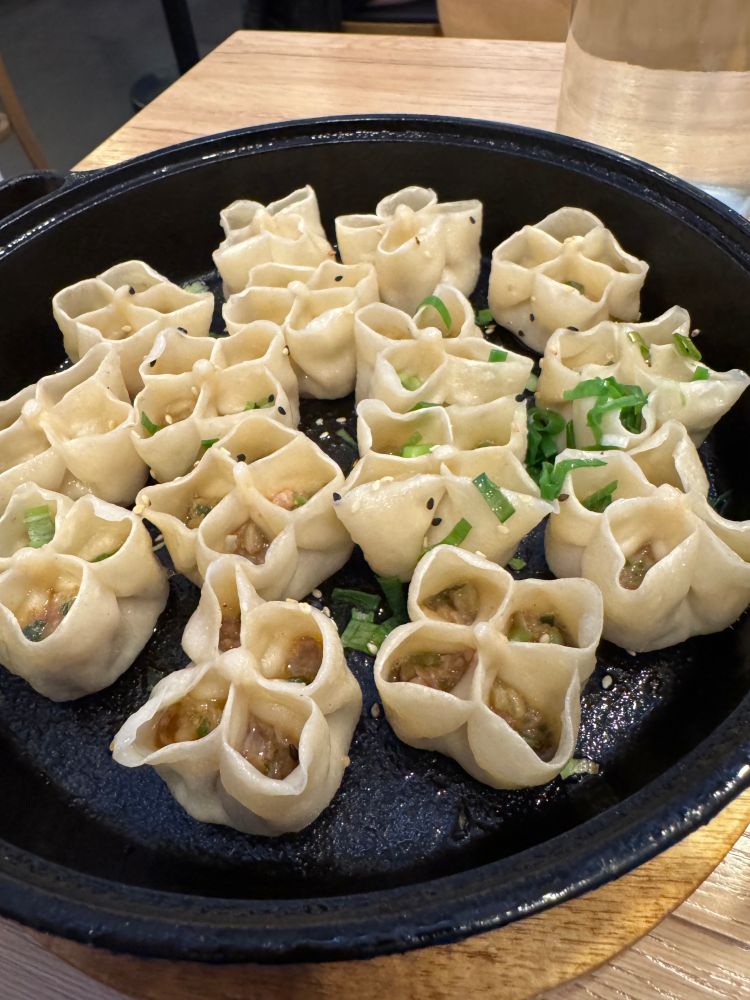 Tibetan momo duplings. Four little pockets filled with meat, veggies, and chili crisp as a condiment. 

I have leftovers for breakfast. 