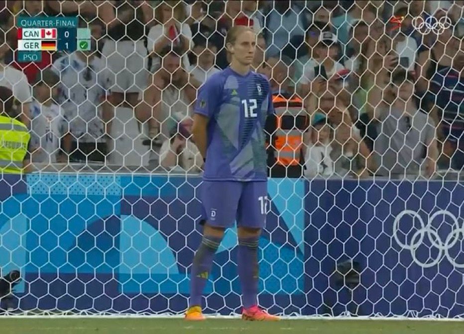 Ann Katrin Berger stands stoically on the goal line as she faces a penalty kick