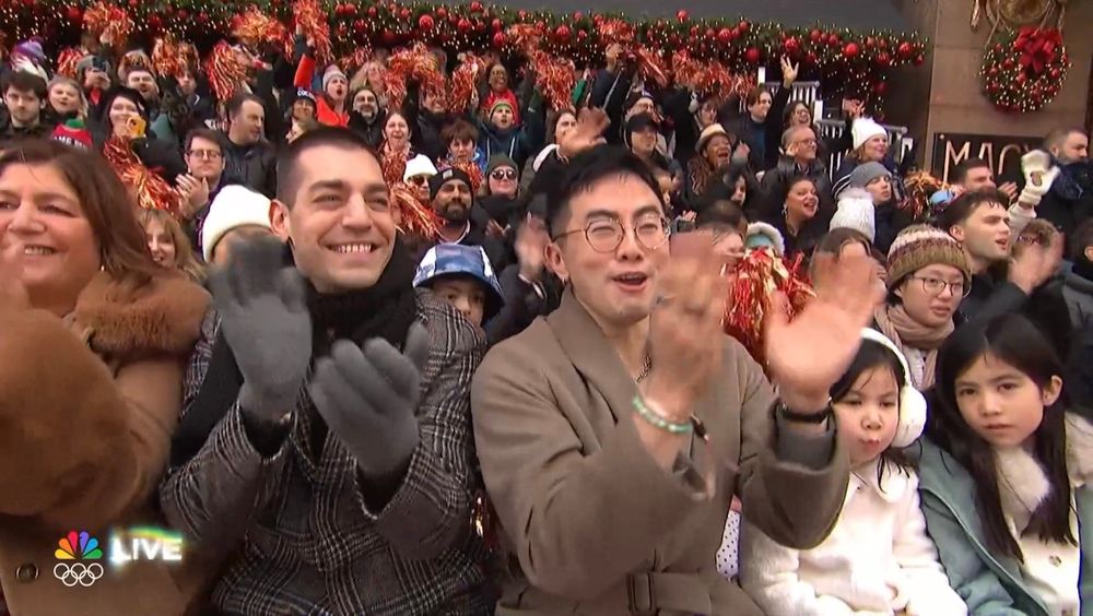 Bowen yang and Matt rogers with in the crowd at the macys parade