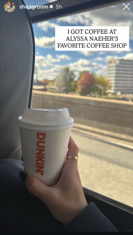 Shea groom is holding up a cup of Dunkin’ Donuts. Text reads: I got coffee at Alyssa Naeher’s favorite coffee shop